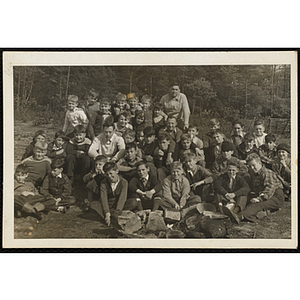 Boys pose for a group shot on a camping trip with Director Boys' Club Camps Mr. Hargorve (5th row, far right) and Bill Cotter (back row, far right)