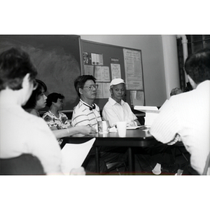 CPA members talking at a Workers' Center meeting