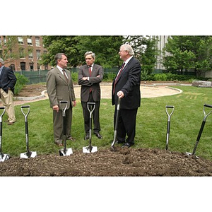 Neal Finnegan, President Freeland, and Richard Neal stand near the shovels for the groundbreaking of the Veterans Memorial