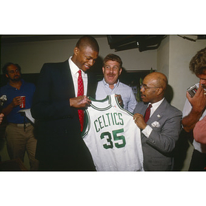 Boston Celtics forward Reggie Lewis shares a pre-game joke with