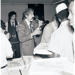 School of Law faculty and students eating and talking during a Pizza Party