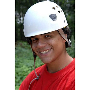 Danny Vazquez smiles at the Torch Scholars Project Adventure Ropes Course