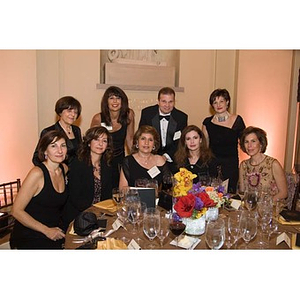 Eight women and a man pose together at the inauguration celebration for President Aoun