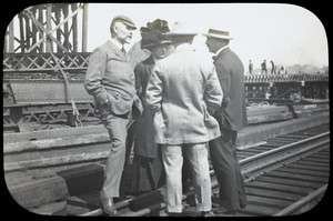 August Belmont, Mrs. Belmont, and two men converse