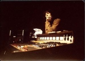 Jimmy Skiathitis leaning on the mixing board in the recording studio