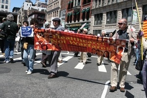 Marchers carrying banner for 'Healthcare not warfare,' during the protest against the war in Iraq