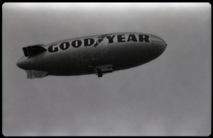 Beatles concert at Shea Stadium: Goodyear blimp floating over the stadium with lights lit up spelling 'Help'