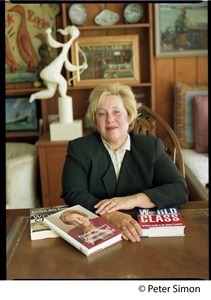 Rosabeth Moss Kanter, seated at a table with her books