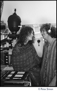 Usha (Cathy Brown) and Peter Simon in a darkroom, next to an enlarger