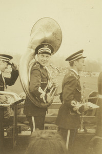Donald G. Wood with sousaphone at football field