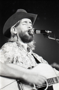 New Riders of the Purple Sage opening for the Grateful Dead at Sargent Gym, Boston University: John 'Marmaduke' Dawson playing acoustic guitar and signing