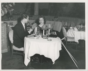 June Trietsch Arzt and unidentified man at a restaurant