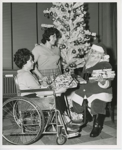 Santa Claus giving gifts to international patients