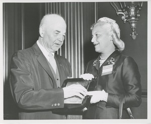 Margaret Milbank Bogert holds the 1956 President's Trophy with awardee Hugo Deffner