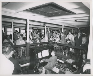 People watch band playing during boat ride