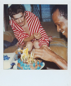 Photographs of Marsha P. Johnson Putting Candles on a Chocolate Birthday Cake