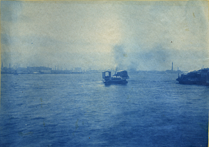 [Unidentified bridge structure being transported over water by tugboats]