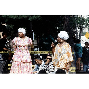 Women in traditional dress performing a bomba or plena on the outdoor stage at Festival Betances.