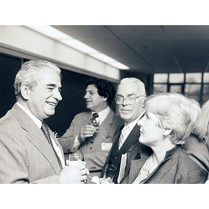 George Kariotis talking to a group of attendees at the Kariotis Hall dedication