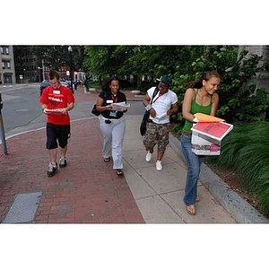 Four Torch Scholars walk together during a scavenger hunt