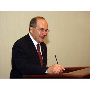 Robert DiCenso, CBA '62, speaking at podium after receiving College of Business Administration's Distinguished Service Award