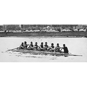 Crew team rowing in the water