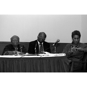 Three panelists at a symposium on civil rights