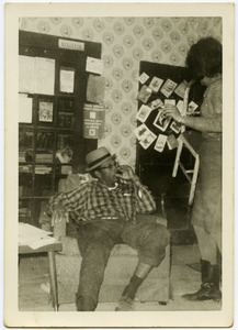 Sammy Lee Rogers, civil rights worker in northern Mississippi (seated in a living room) with unidentified woman