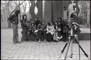 Camera set up to film Richard Safft (reading) and other commune members during interview by Channel 5 news