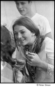 Judy Collins talking with Joan Baez at the Newport Folk Festival