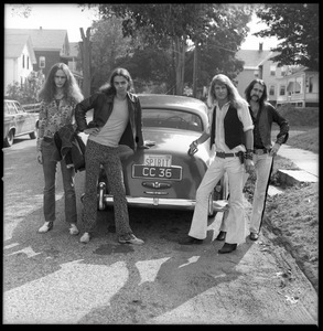 Spirit in Flesh, Brotherhood of the Spirit commune band, posed in with a Rolls Royce in front of the commune house on Chestnut Street, Turners Falls