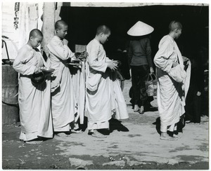 Buddhist nuns with begging bowls