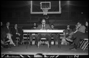 Joseph S. Marcus (engineering faculty and administrator, UMass Amherst) moderates at open meeting with school administration, Curry Hicks Cage, regarding protests against war in Vietnam