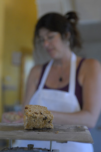 Hungry Ghost Bread: owner and baker Cheryl Maffei weighing goods at a scale