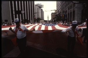 Veterans carrying a large American flag in the San Francisco Pride Parade