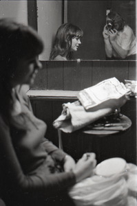 Linda Ronstadt at Paul's Mall: Ronstadt backstage working on needlepoint, Jeff Albertson reflected in mirror