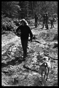 Communards walking down a muddy road, Earth People's Park