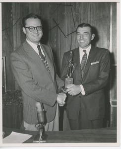 Ed Furgol receiving a trophy from unidentified ICD representative