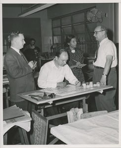 Unidentified sign maker and three onlookers