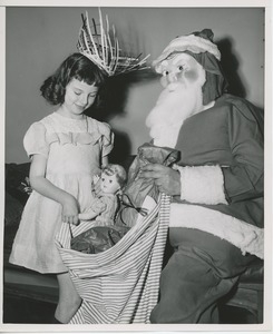 Santa Claus with Mary McMahon and bag of gifts