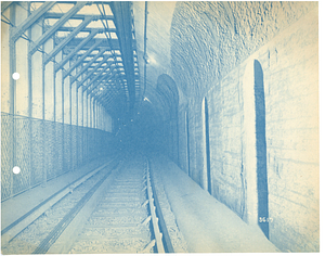 Train tracks inside unidentified subway tunnel