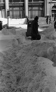 Snow clearing equipment and unidentified man clearing snow on Berkeley Street