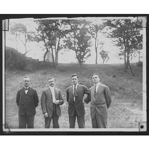 Group poses for photo outdoors at Camp School, Allston