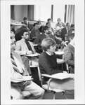 Members of Suffolk University's College of Arts and Sciences (CAS) faculty meet in a classroom, photograph, 1979