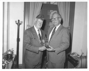 John Joseph Moakley receives an award from a veteran, 1980s-1990s
