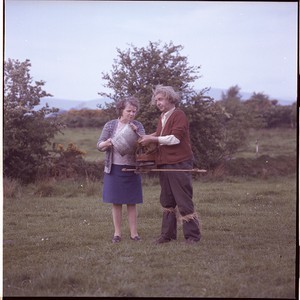 Mick Sands, singer, father of the Sands Family, singers, with his wife Bridie as he sowed seeds using a "fiddle"