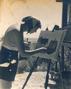 My mother painting on the beach