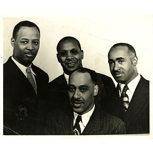 Reverend Dr. Wm. Frederick Fisher and Laymon Hunter pose with two men