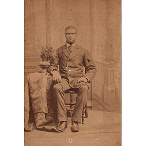 A bearded African American man sitting for a portrait