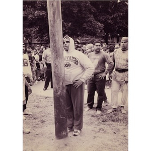 Man standing before the greased pole with eyes closed during the Greased Pole contest at Festival Betances.